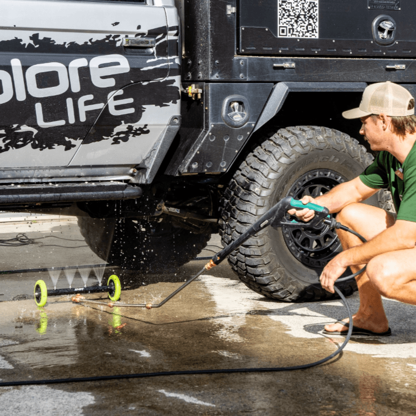 car being cleaned by men