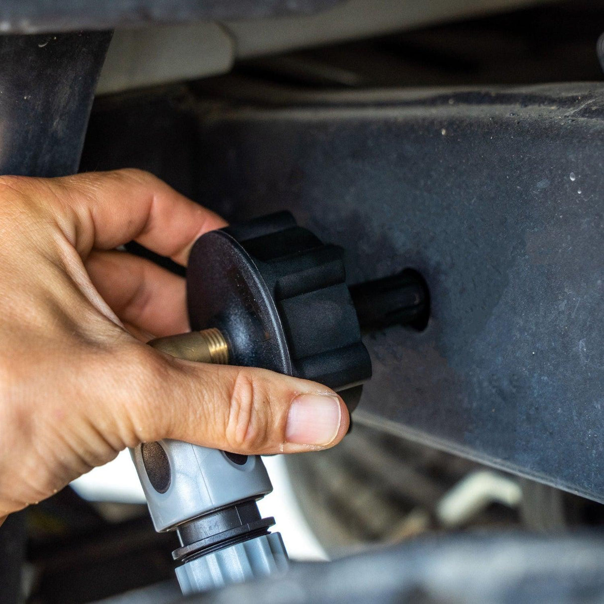 A Salt Shift chassis flusher attached to a 4x4 frame for underbody cleaning.